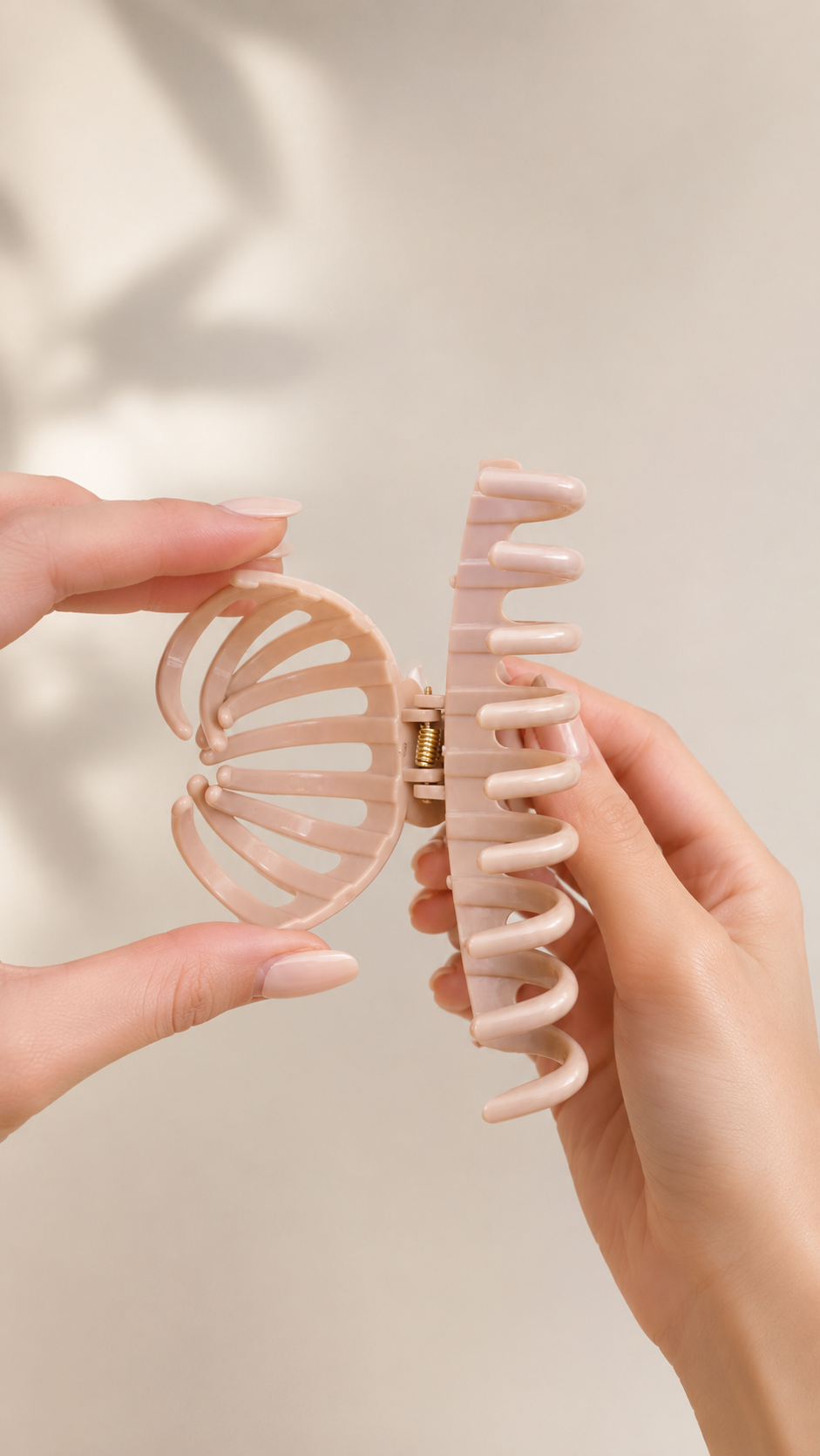 Two flexible FlexiClaw hair clips being compared